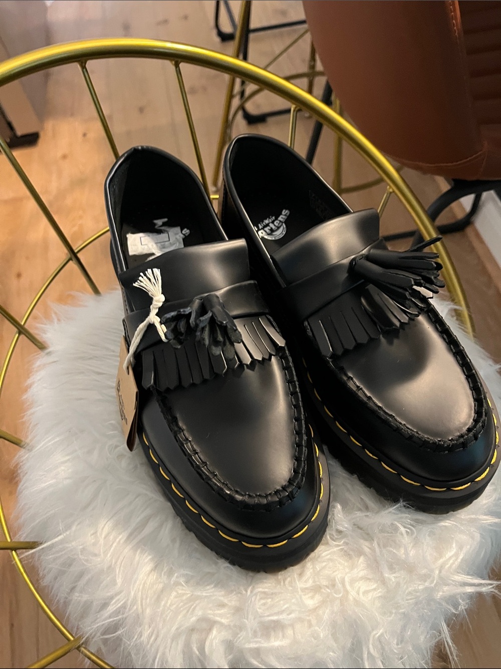 Dr. Martens Black Kiltie Tassel Loafers with Yellow Welt Stitching